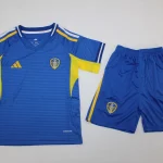 Kit de niño Leeds United visitante 25/26