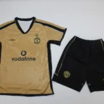 Kit de niño Manchester United retro 100 aniversario (reversible)